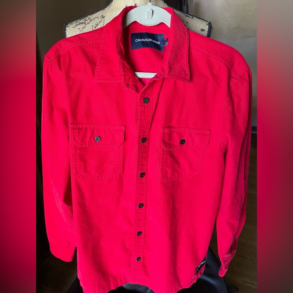 Calvin Klein long sleeve button down shirt.  Corduroy feel in thickness. Size L